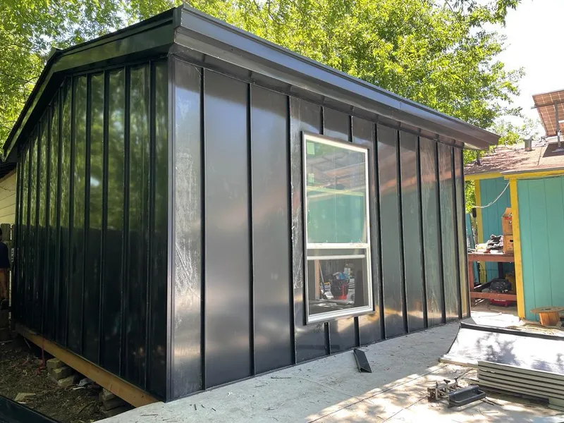 Black standing seam metal wall panels for Metal Roof Installation in Ames