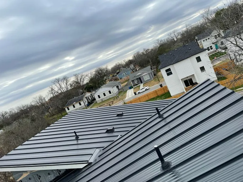 Standing seam metal roof panels with vents for Skylight Repair in Ames